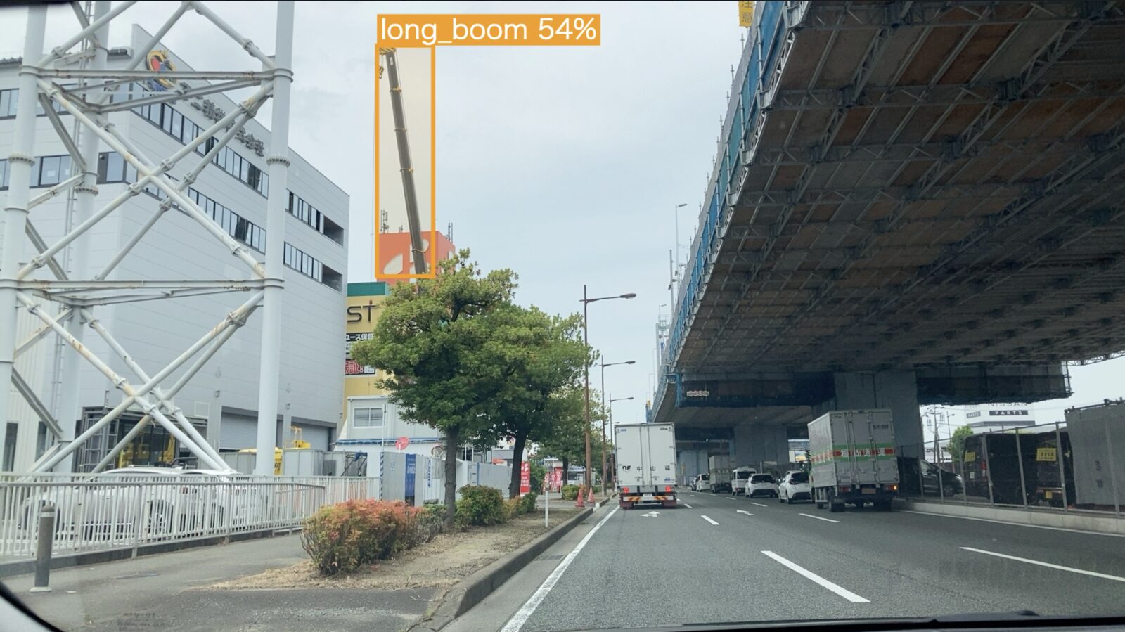 A street scene from a moving vehicle, with the extended boom boxed and labelled long_boom at 54%